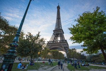 Fototapeta na wymiar PARIS, FRANCE, SEPTEMBER 5, 2018 - View of Tour Eiffel from Champ de Mars in Paris, France.