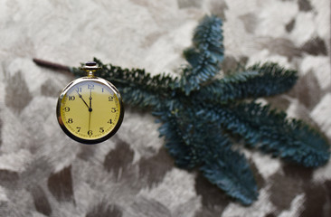 vintage pocket watch on gold background
