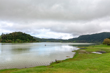 Calm water at the Lagoa das Furnas near Furnas in Sao Miguel, Azores.