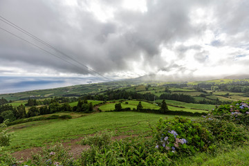 Beautiful view of the dramatic cloudscape above Vila Franca do Campo on Sao Miguel, Portugal.