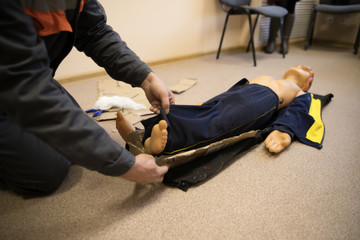 Adult Manikin CPR Training. First Aid CPR Training Chest Compression on CPR Training Manikin Dummy for Help People who Heart Failure and Senseless in Emergency.