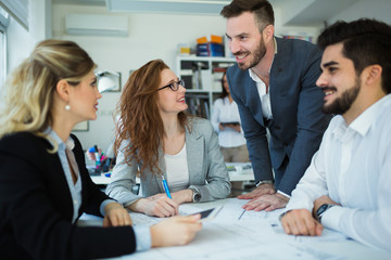 Business people working together on project and brainstorming in office