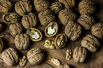 Walnuts on wooden table.