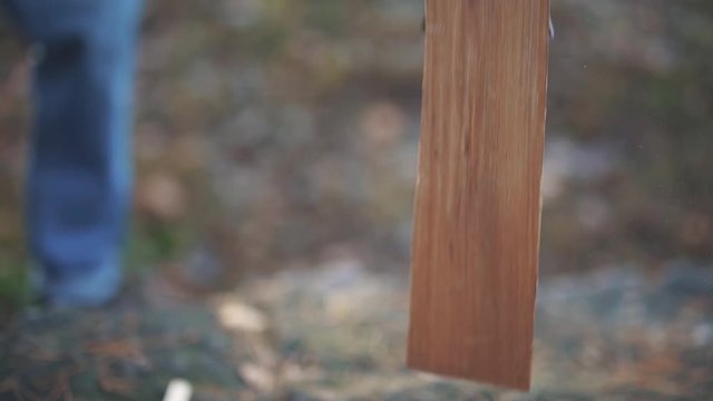 Ax chopping a log close up. Wood chopping. Slow motion.