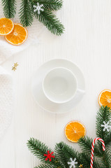 Christmas composition with empty white cup and decorations