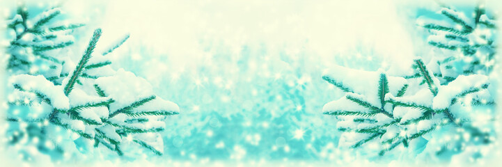 Beautiful fir tree covered snow, closeup. Winter Christmas greeting card panoramic background, copy space. Holiday spruce branches landscape, falling snowflakes. Nature panorama. Soft vintage toned