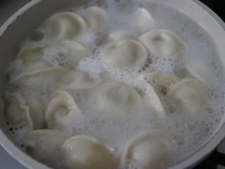 dumplings are cooked in boiling water.