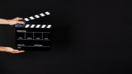 Two Hand's holding Clapperboard or movie slate use in video production ,film, cinema industry on...