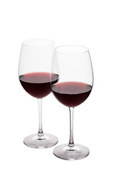 Two red wine glasses on the white background