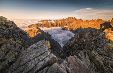 Fototapeta na wymiar Mountains Landscape with Inversion in the Valley at Sunset as seen From Rysy Peak in High Tatras, Slovakia