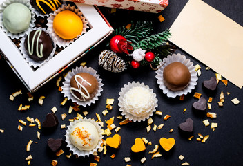 Different truffles on a dark background