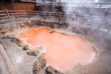 Kamado Jigoku (Cooker Hell) pond in autumn, which is one of the famous natural hot springs viewpoint, representing the various hells in Beppu
