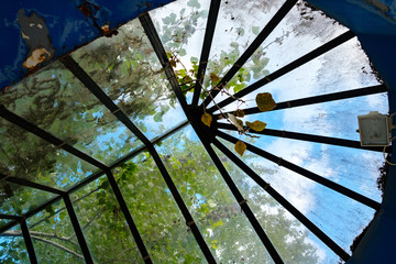 roof in the form of glass stained glass, dirty old stained glass with leaves