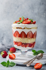 Strawberry trifle. layered dessert with fresh berry and cream cheese