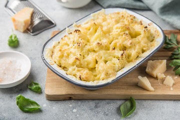 cauliflower and cheese gratin in baking dish, selective focus