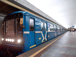Metro train arrived at the station. Wagons of subway in underground. Subway station. Public speed...