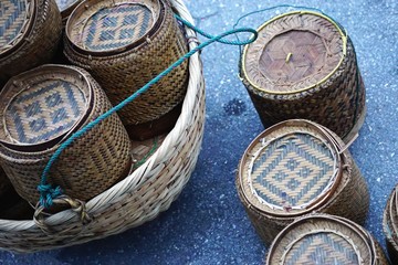 Closeup of traditional handwoven bamboo basket sticky rice containers at a market in Luang Prabang, Laos