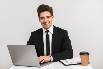 Smiling young business man wearing suit