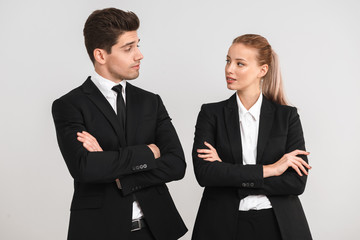 Confident young business couple standing