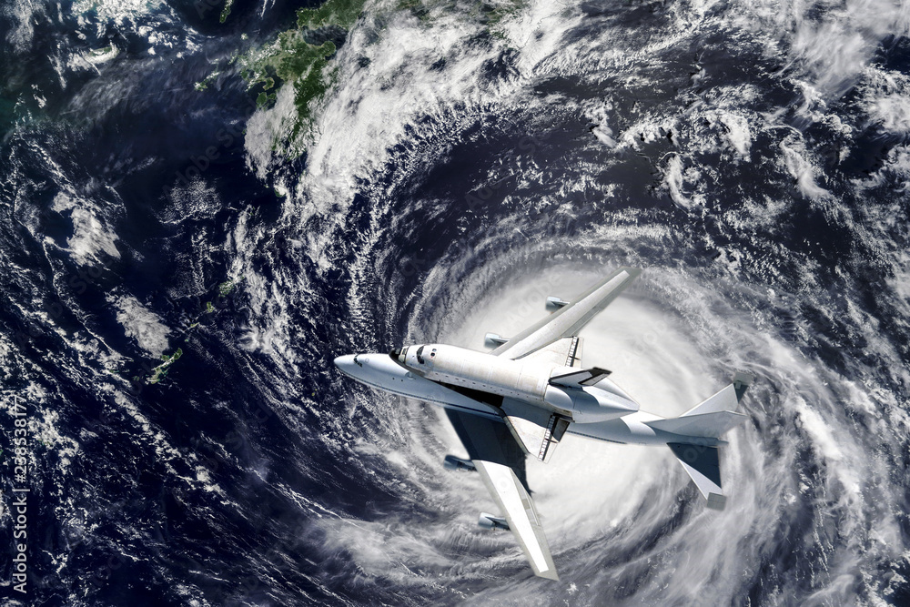 Wall mural space ship shuttle on the earth orbit in atmosphere. flying in outer space. elements of this image f