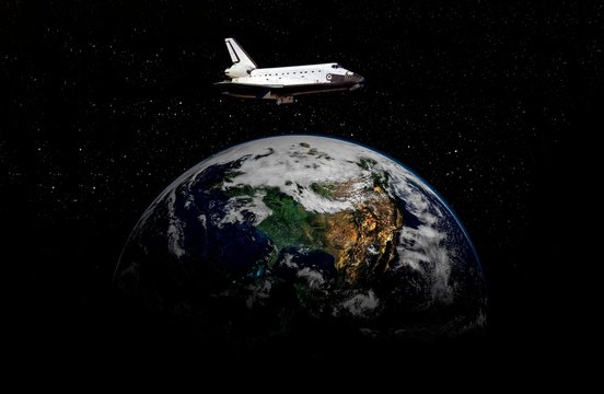 space ship shuttle on the earth orbit in atmosphere. flying in outer space. Elements of this image furnished by NASA