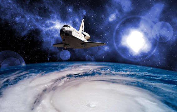 space ship shuttle on the earth orbit in atmosphere. flying in outer space. Elements of this image furnished by NASA