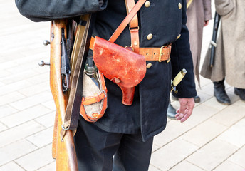 Vintage leather holster and other ammunition on the belt