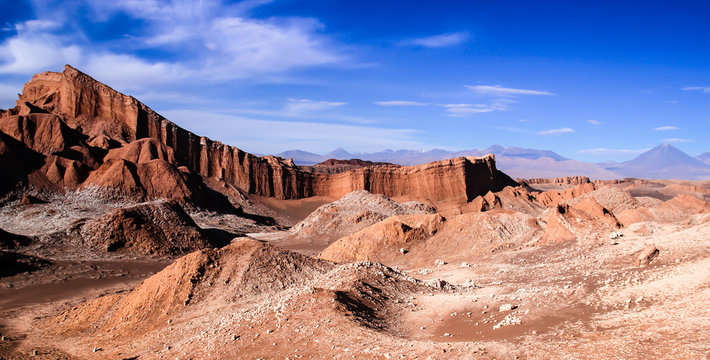 Iconic rock formation in valle de la luna near San Pedro de Atacama feat. vulcano Licancabur in the background