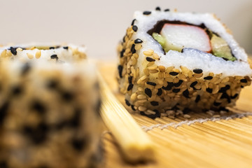 Close-up of sliced sushi rolls. © Road Red Runner