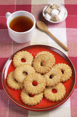 Sweet shortbread cookies and tea in cup