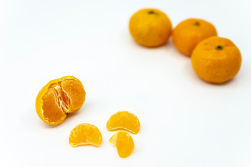 Small ripe mandarin orange isolated on white background.