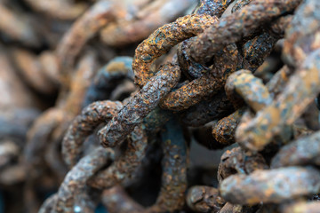 Rusty chains eroded by sea water