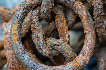 Rusty chains eroded by sea water