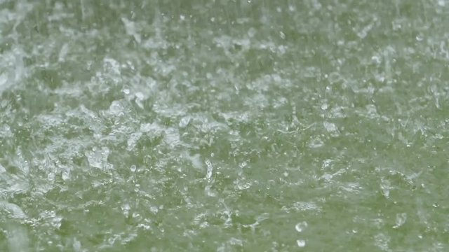 water drops fall into the water