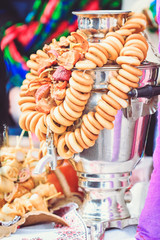 Samovar with bagel treats on it