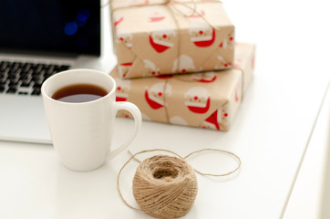 Flat lay Christmas gifts on a table.