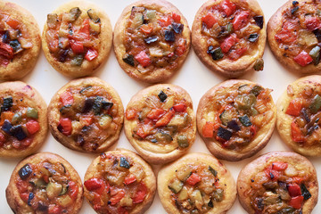 Freshly baked mini pizzas Cocas