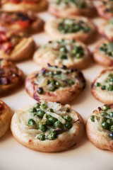 Freshly baked mini pizzas Cocas