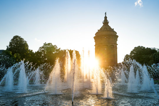 Germany, Baden-Wuerttemberg, Mannheim, Water Tower and fountain at sunset