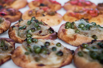 Freshly baked mini pizzas cocas