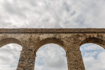 Fototapeta na wymiar View of the Roman Aqueduct of the coastal city of Almuñecar Spain