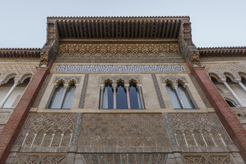 Fototapeta na wymiar Part of the facade of the Real Alcázar de Sevilla, a Moorish style building