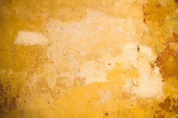 old yellow wall background or texture