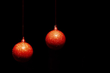 Two Christmas balls in color of living coral