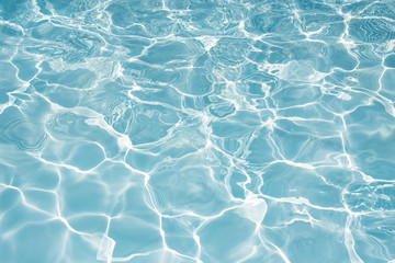 Texture of water in swimming pool for background