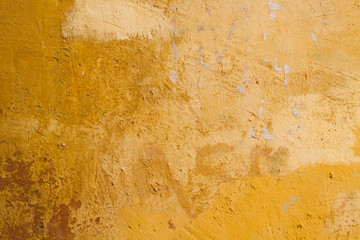 Old yellow wall background or texture