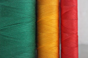texture background textile thread clothing green red yellow orange traffic light colorful colors horizontal ornament pattern beautifully macro cotton silk material for clothing clothes dressmaker tail