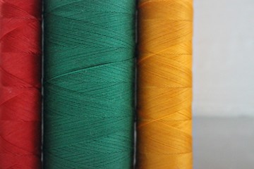texture background textile thread clothing green red yellow orange traffic light colorful colors horizontal ornament pattern beautifully macro cotton silk material for clothing clothes dressmaker tail