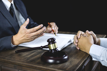 Meeting and collaboration concept, Businessman and Male lawyer or judge consult having team meeting with client discussing of contract in courtroom