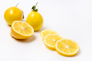Slace of Fresh Ripe Lemon and Wooden Honey Dipper on White Background Honey Horizontal